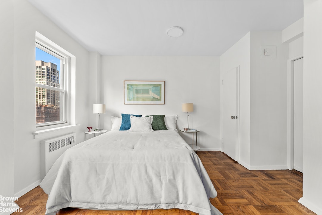 11 Riverside Drive, Unit 15OE Manhattan, NY 10023 - Photo 3 of 12 a bedroom with a bed and a window