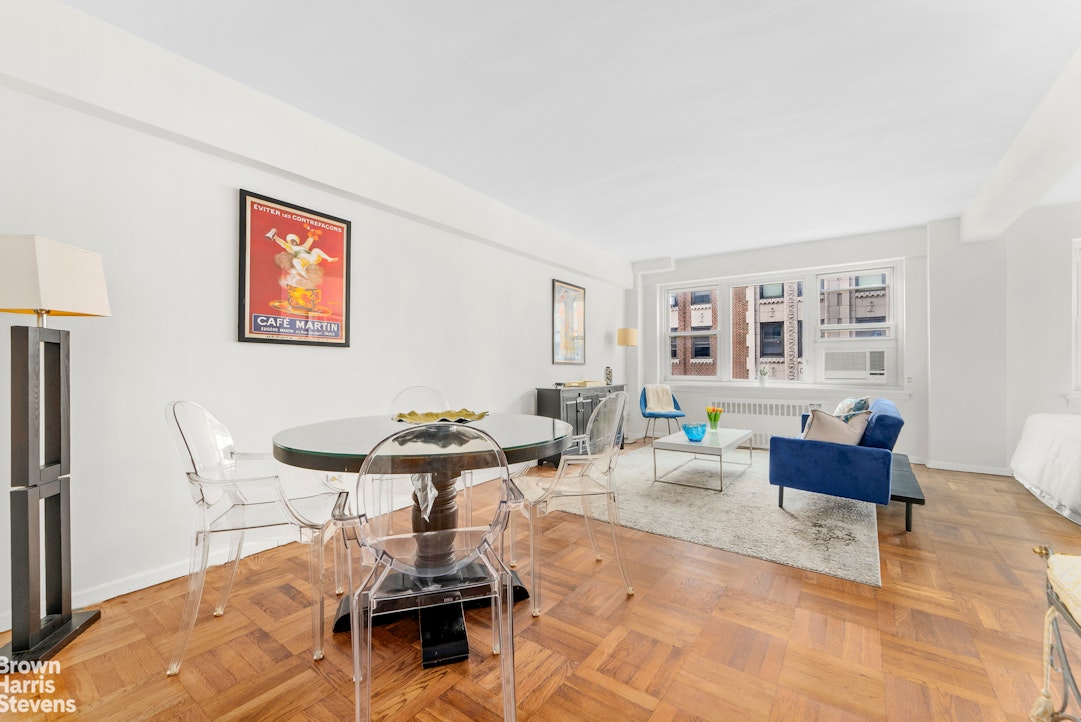 11 Riverside Drive, Unit 15OE Manhattan, NY 10023 - Photo 4 of 12 a living room with furniture and wooden floor
