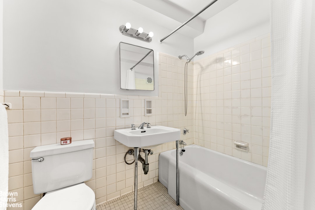 11 Riverside Drive, Unit 15OE Manhattan, NY 10023 - Photo 6 of 12 a bathroom with a sink toilet and shower