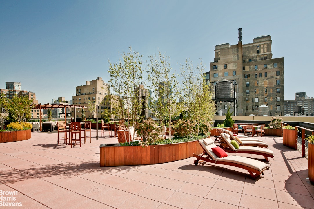 11 Riverside Drive, Unit 15OE Manhattan, NY 10023 - Photo 9 of 12 a outdoor space with lots of furniture and plants
