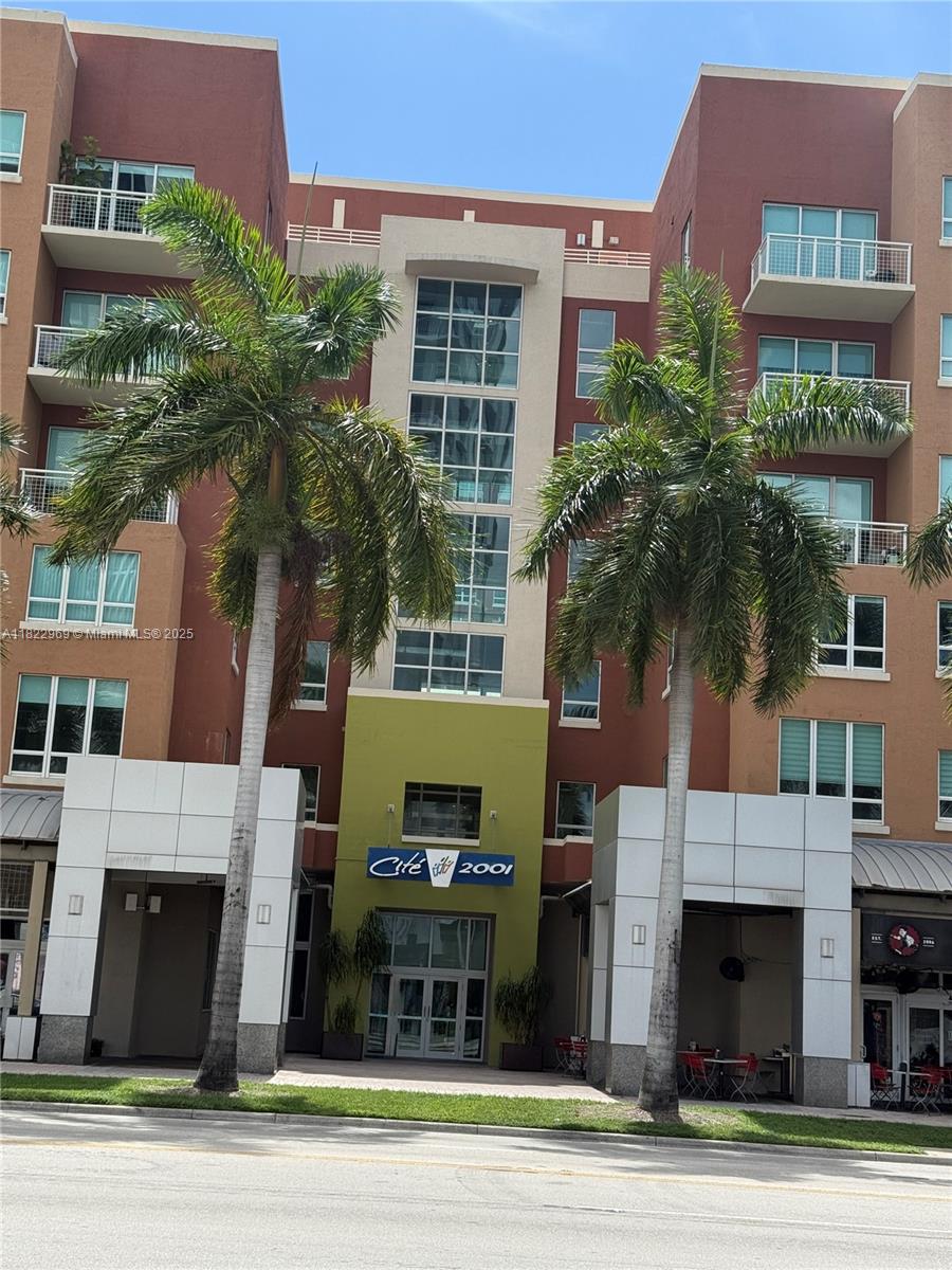 a view of a building and a yard