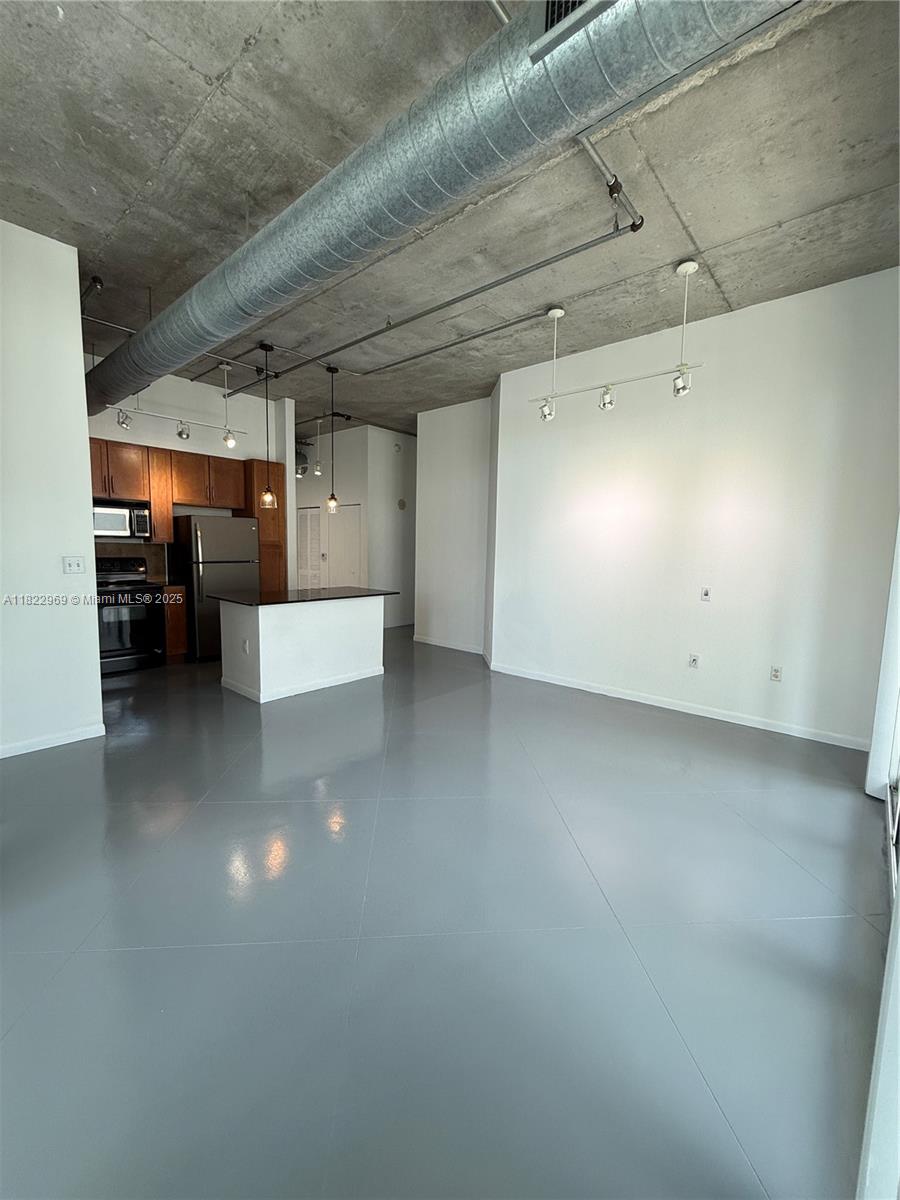 2001 Biscayne Boulevard, Unit 2402 Miami, FL 33137 - Photo 11 of 64 a view of a hallway with stairs