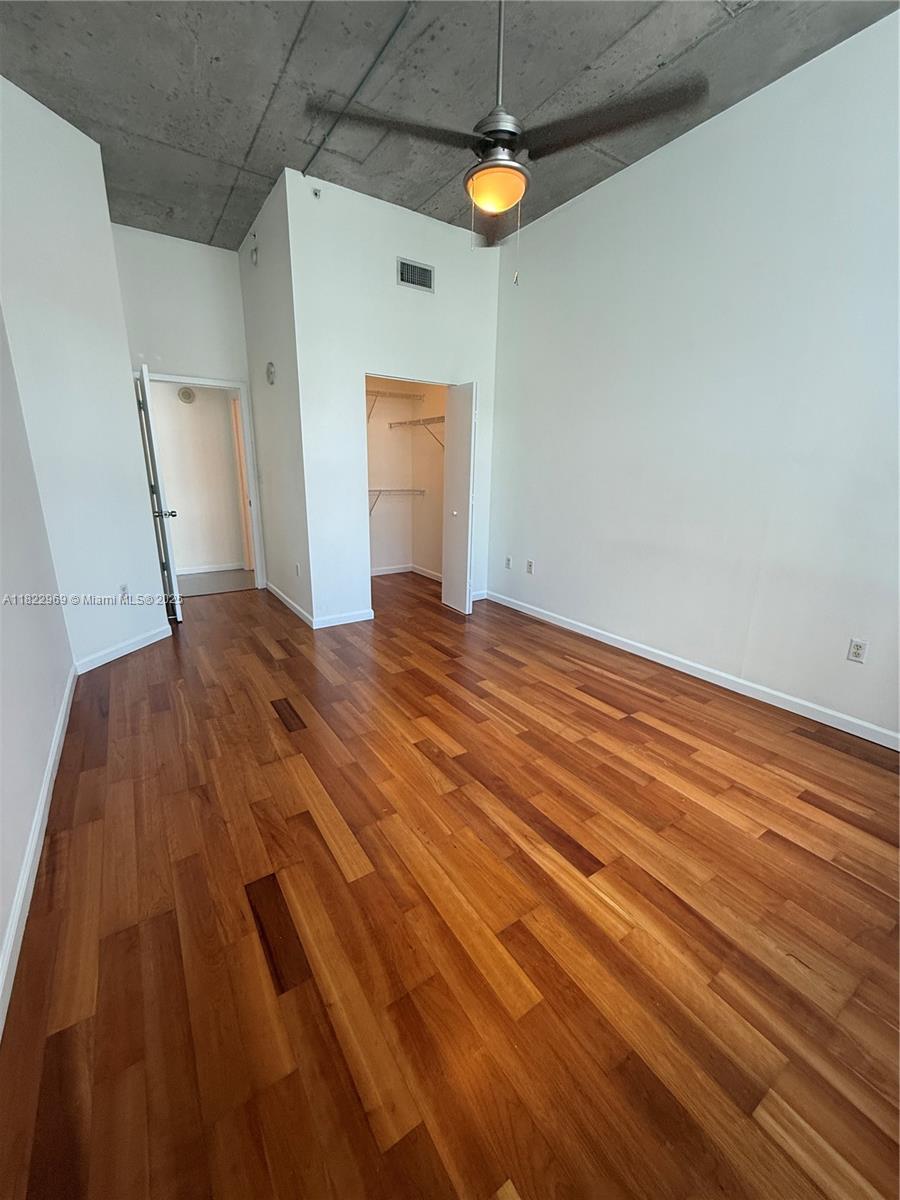 2001 Biscayne Boulevard, Unit 2402 Miami, FL 33137 - Photo 22 of 64 a view of empty room with wooden floor