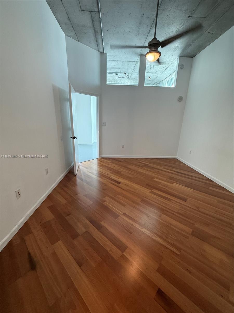 2001 Biscayne Boulevard, Unit 2402 Miami, FL 33137 - Photo 29 of 64 a view of a room with wooden floor