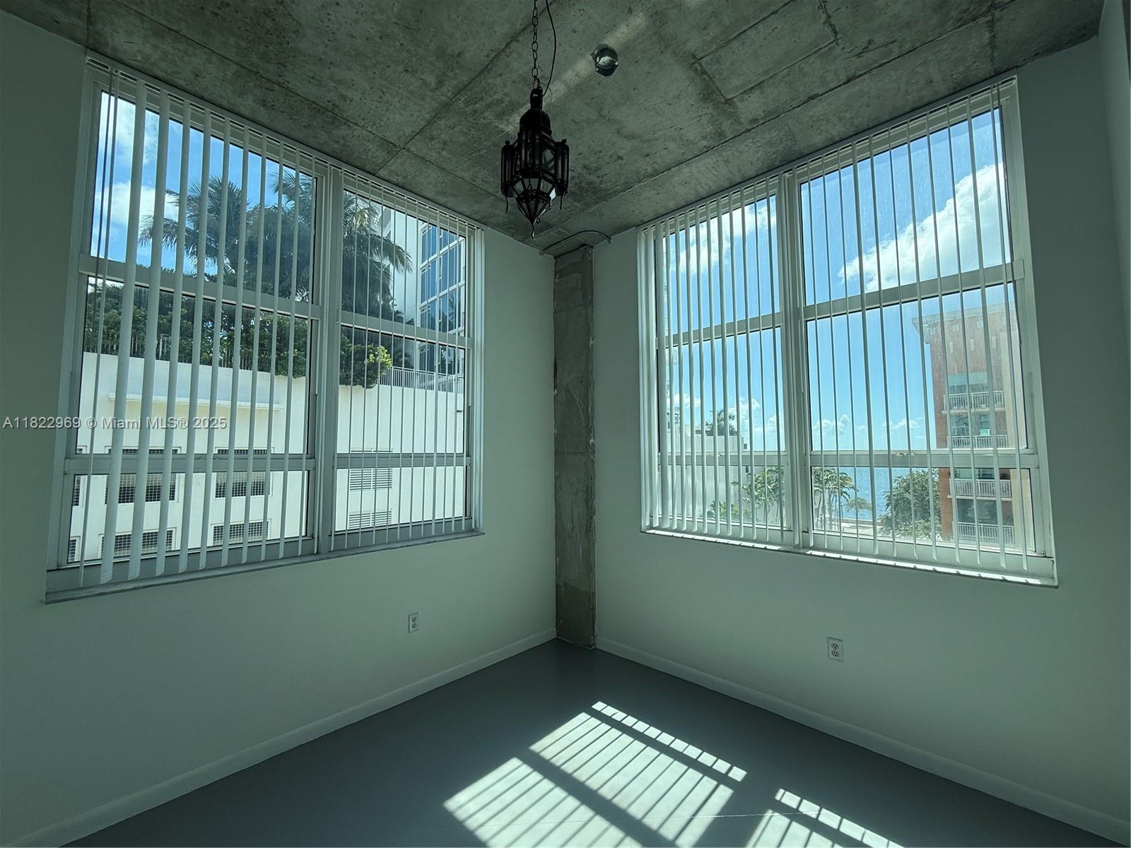 2001 Biscayne Boulevard, Unit 2402 Miami, FL 33137 - Photo 4 of 64 a view of an empty room with a window