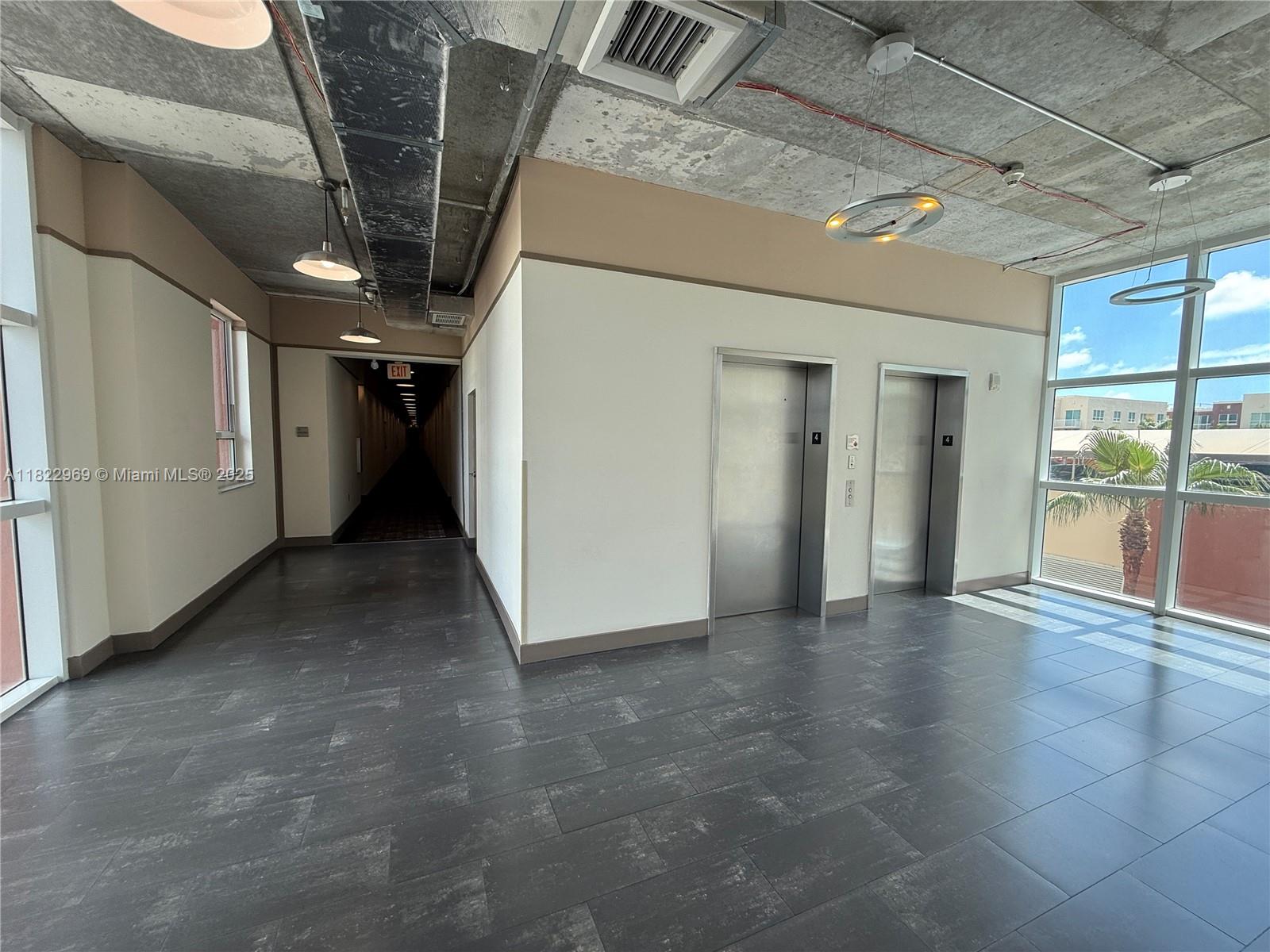 2001 Biscayne Boulevard, Unit 2402 Miami, FL 33137 - Photo 42 of 64 a view of hallway with stairs