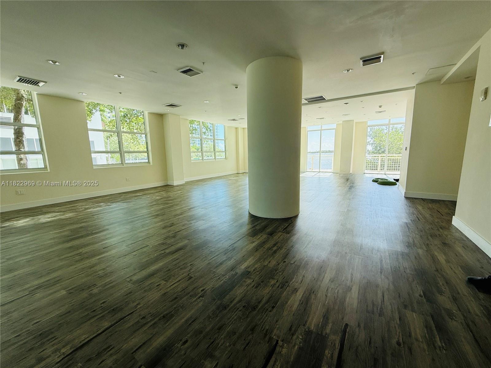 2001 Biscayne Boulevard, Unit 2402 Miami, FL 33137 - Photo 47 of 64 a view of empty room with wooden floor and fan