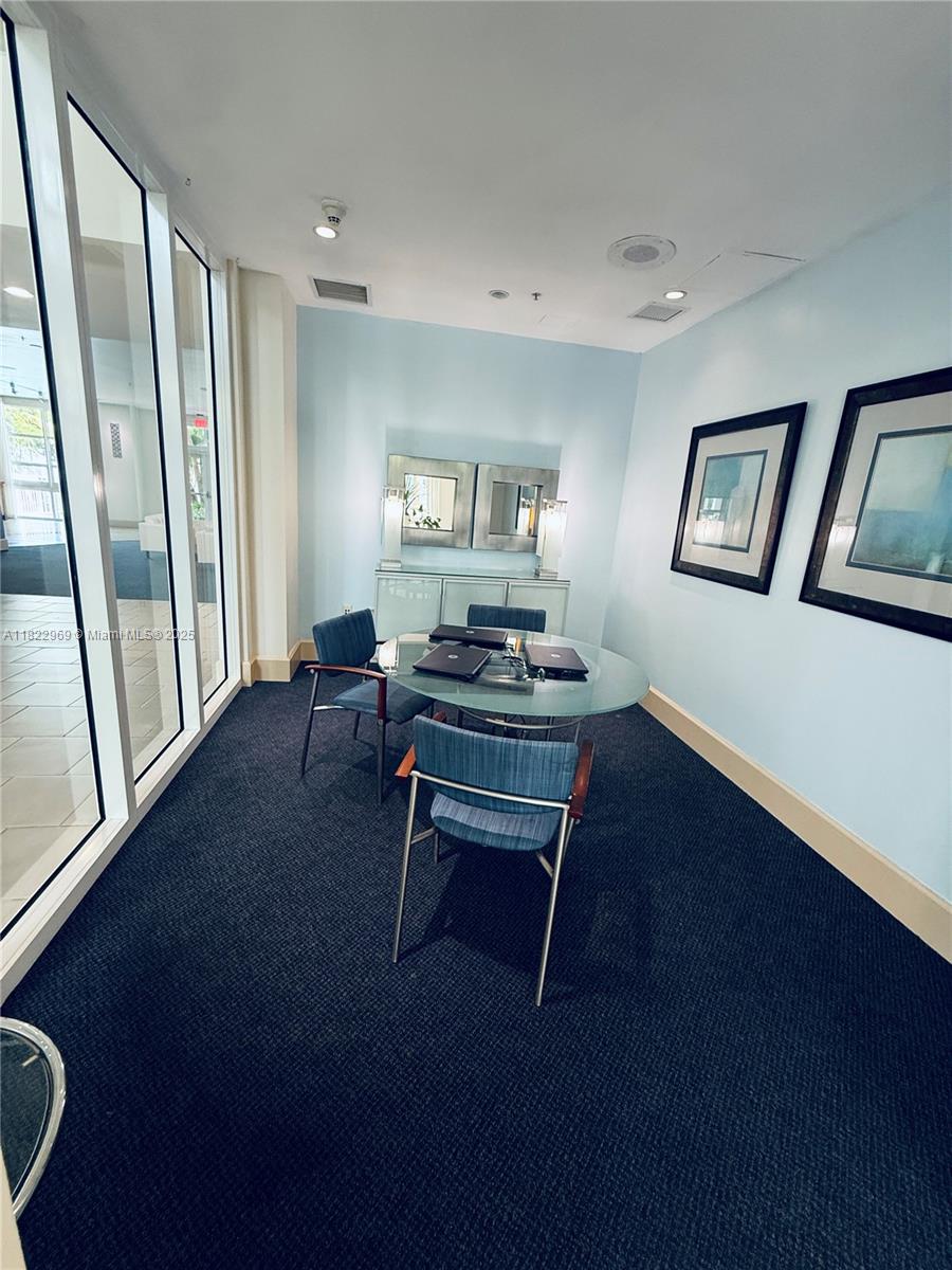 2001 Biscayne Boulevard, Unit 2402 Miami, FL 33137 - Photo 54 of 64 a living room with furniture and a wooden floor