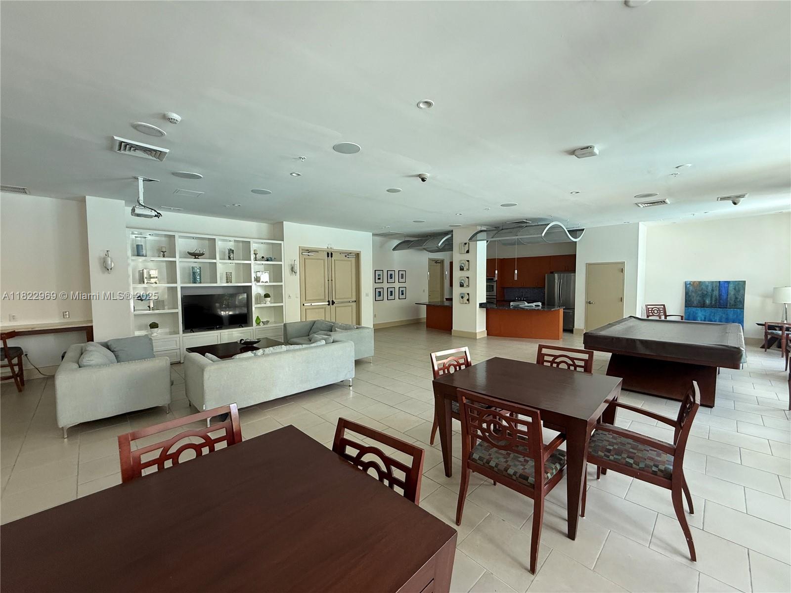 2001 Biscayne Boulevard, Unit 2402 Miami, FL 33137 - Photo 61 of 64 a living room with furniture and a flat screen tv