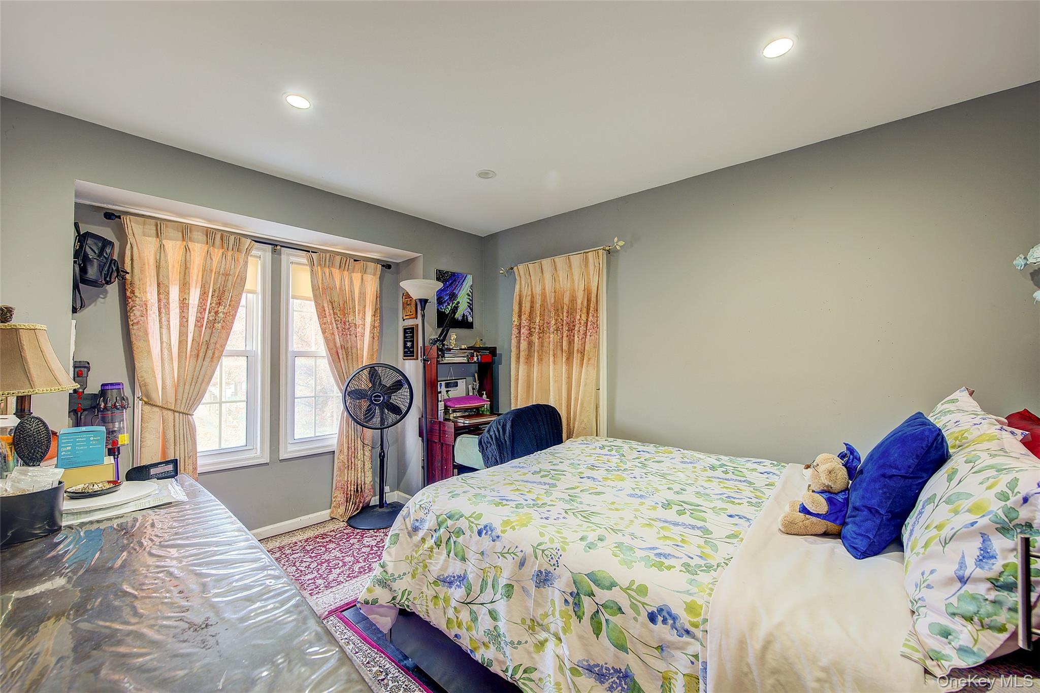 89-06 175th Street Queens, NY 11432 - Photo 15 of 29 Carpeted bedroom featuring baseboards and recessed lighting