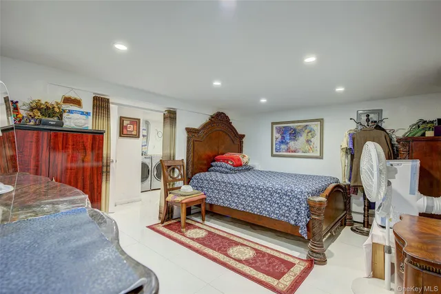 a bedroom with furniture and a window