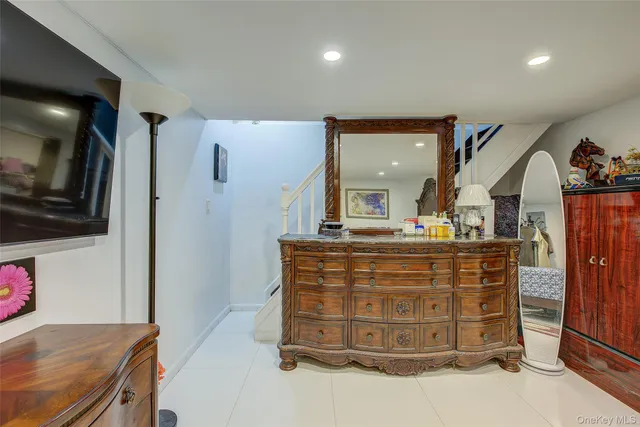 a view of living room with cabinets