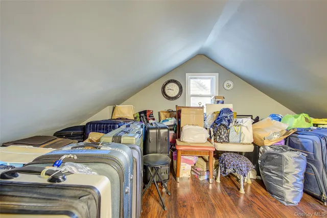 a bedroom with two beds and a chandelier