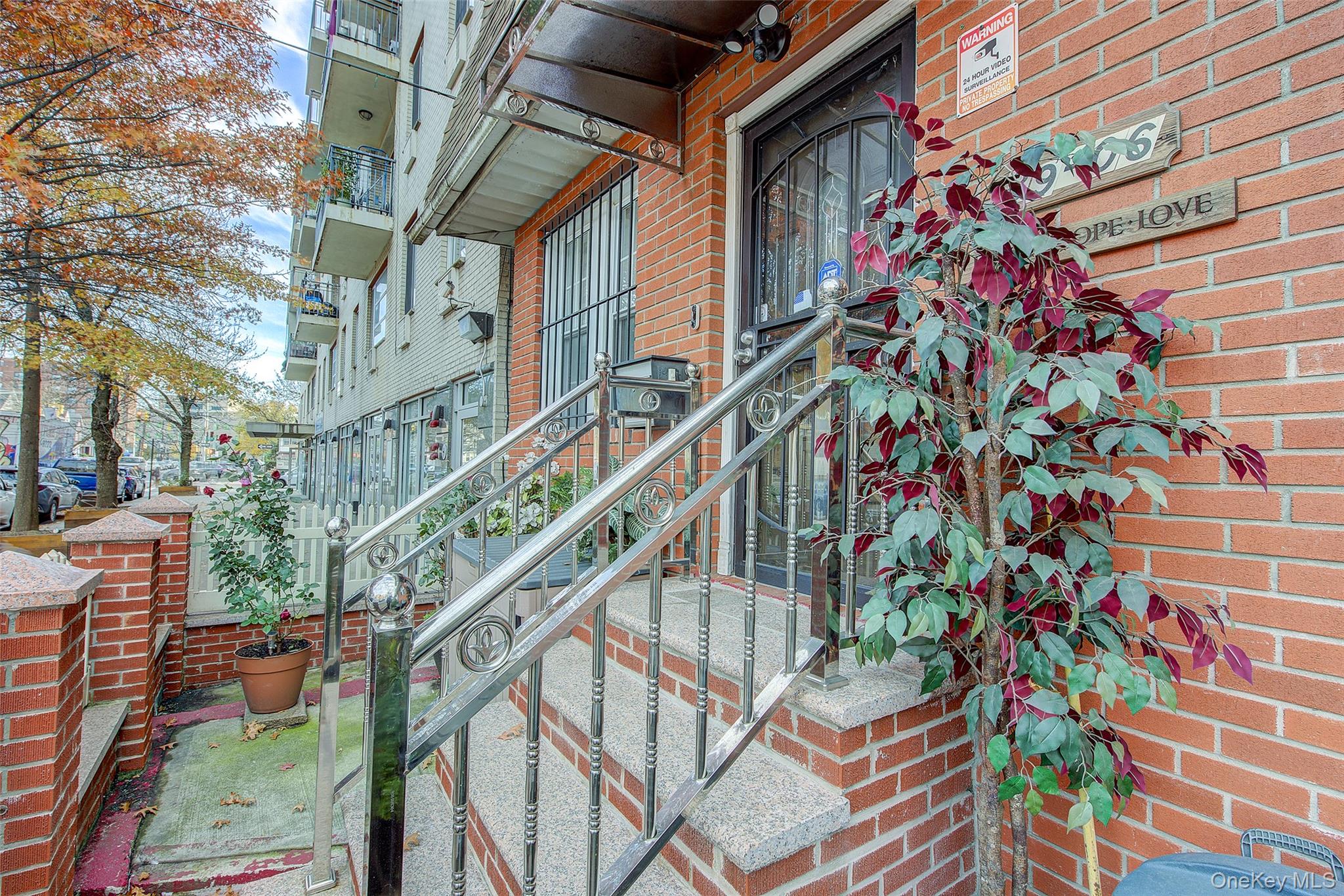 89-06 175th Street Queens, NY 11432 - Photo 28 of 29 View of exterior entry with brick siding