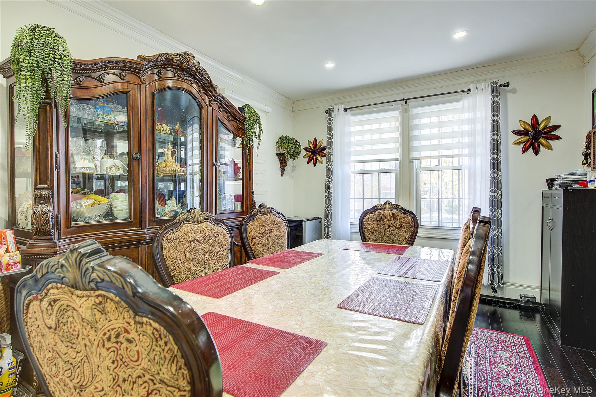 89-06 175th Street Queens, NY 11432 - Photo 8 of 29 Dining space featuring ornamental molding, dark wood-style floors, and recessed lighting
