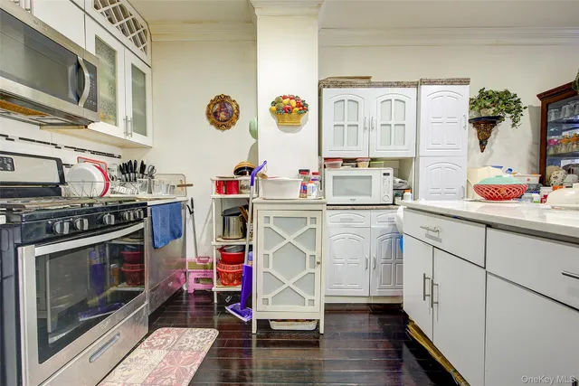 a utility room with cabinets dryer and washer
