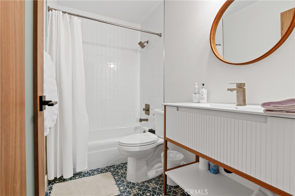 34561 Calle Monte Dana Point, CA 92624 - Photo 16 of 22 a bathroom with a sink a toilet and a mirror