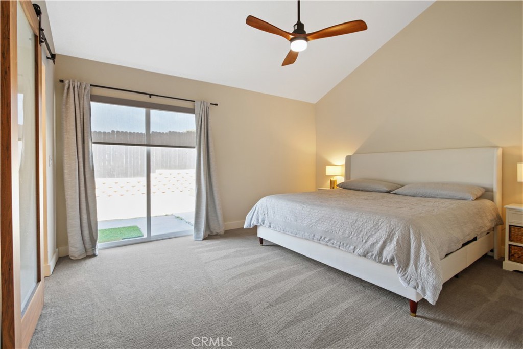 34561 Calle Monte Dana Point, CA 92624 - Photo 10 of 22 a bedroom with a large bed and a chandelier