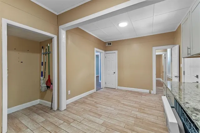 a view of a small space with wooden floor