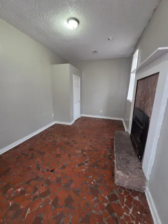 a view of a livingroom with wooden floor