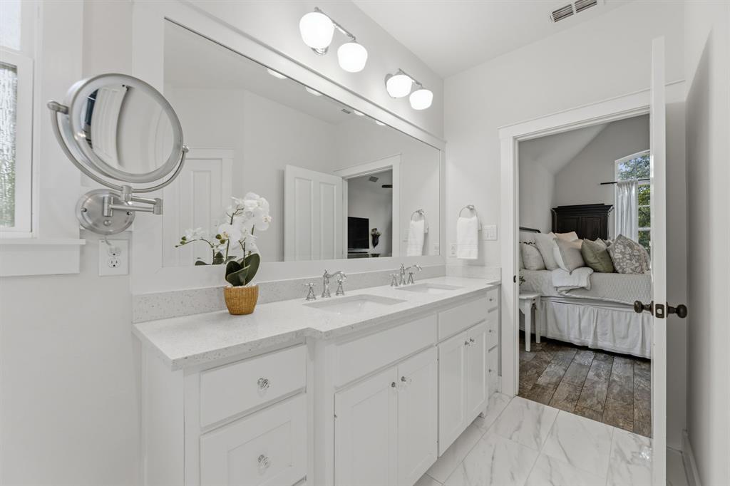 665 Chinn Chapel Road Copper Canyon, TX 75077 - Photo 20 of 26 a en suite bathroom with a granite countertop sink and a mirror