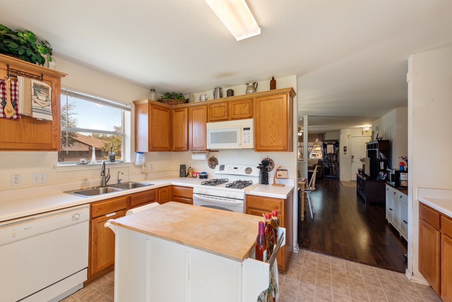 5501 English Avenue Austin, TX 78724 - Photo 8 of 19 a kitchen with a sink stove and cabinets