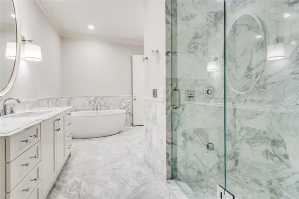 a spacious bathroom with a double vanity sink mirror double and shower