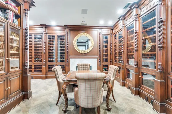 a dining room with furniture and a floor to ceiling window