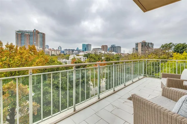 a view of a balcony with city view
