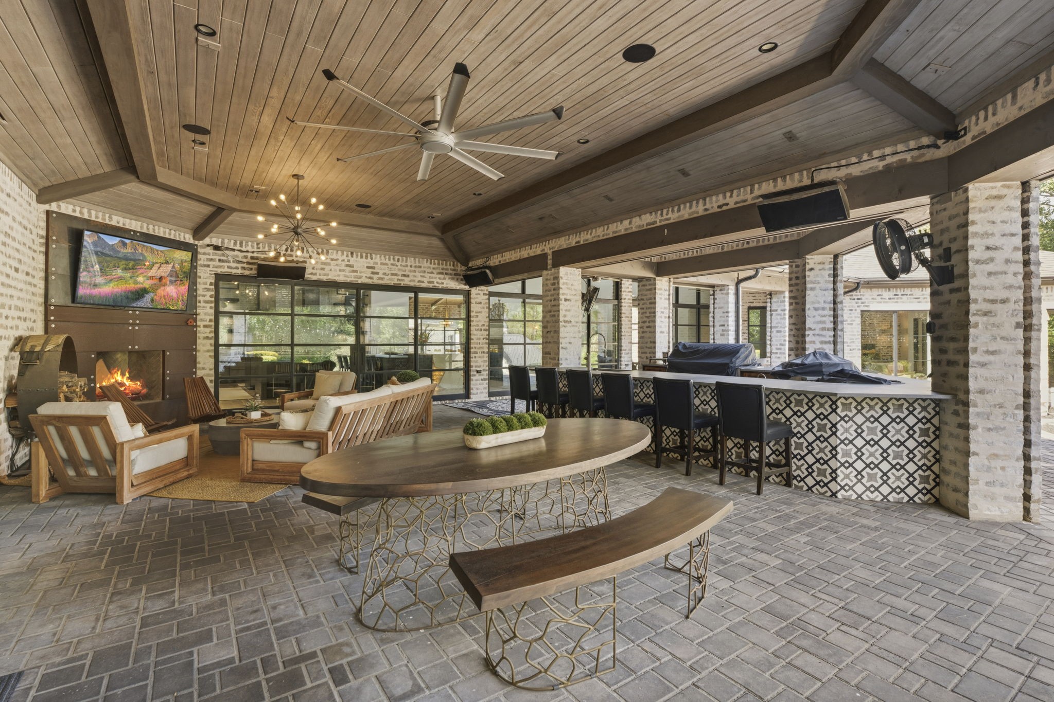 27006 Star Gazer Way Spring, TX 77386 - Photo 46 of 50 Outdoor entertaining reaches the next level with a fully equipped kitchen featuring a gas grill, Evo griddle grill, side burner, ice maker, sink, and two beverage refrigerators.