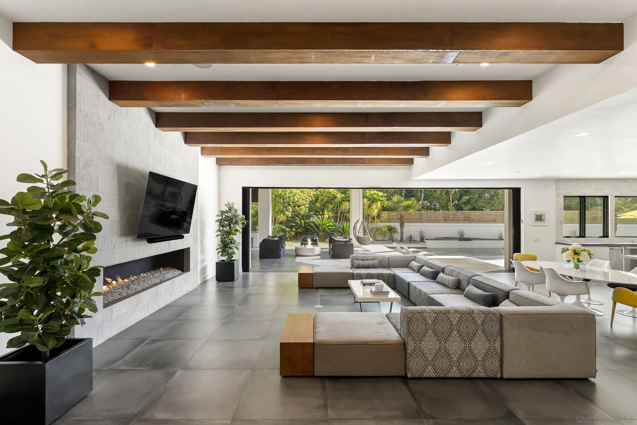 6850 Avenida De La Ronda Rancho Santa Fe, CA 92067 - Photo 9 of 40 a living room with furniture tv and a large window