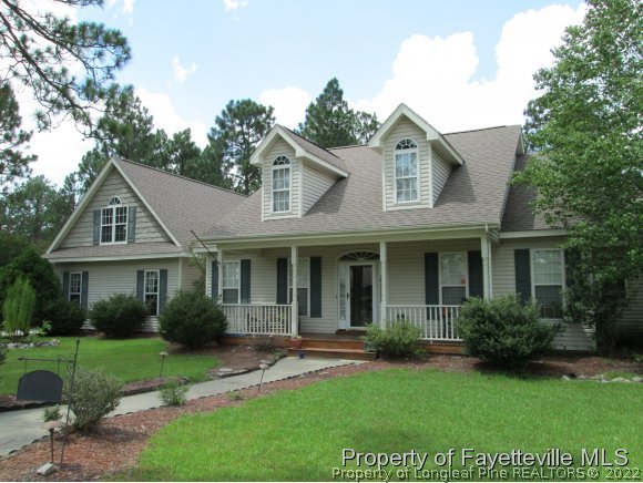 702 Wildwood Road Aberdeen, NC 28315 - Photo 1 of 19 a view of a yard in front of house