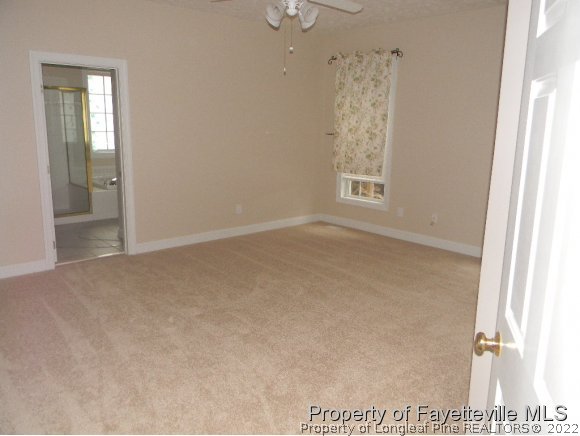 702 Wildwood Road Aberdeen, NC 28315 - Photo 11 of 19 an empty room with windows and closet