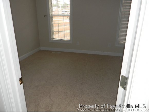702 Wildwood Road Aberdeen, NC 28315 - Photo 12 of 19 an empty room with a window