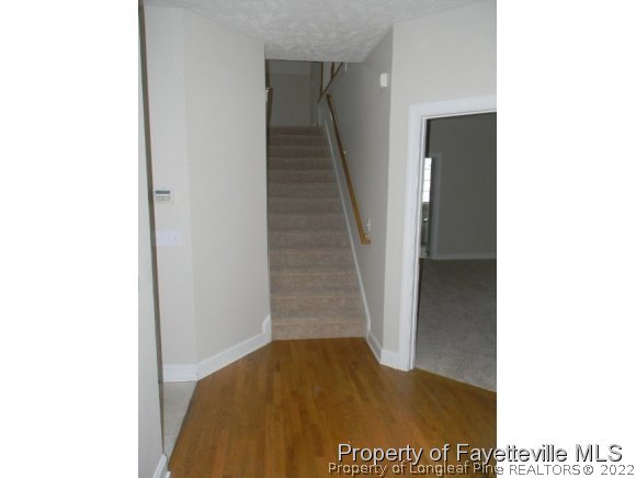 702 Wildwood Road Aberdeen, NC 28315 - Photo 13 of 19 a view of hallway with stairs