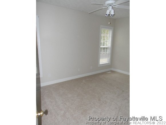 702 Wildwood Road Aberdeen, NC 28315 - Photo 15 of 19 a view of an empty room with a window