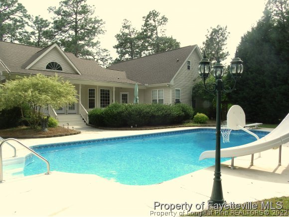 702 Wildwood Road Aberdeen, NC 28315 - Photo 17 of 19 a front view of a house with garden