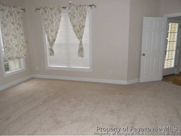 702 Wildwood Road Aberdeen, NC 28315 - Photo 9 of 19 an empty room with windows