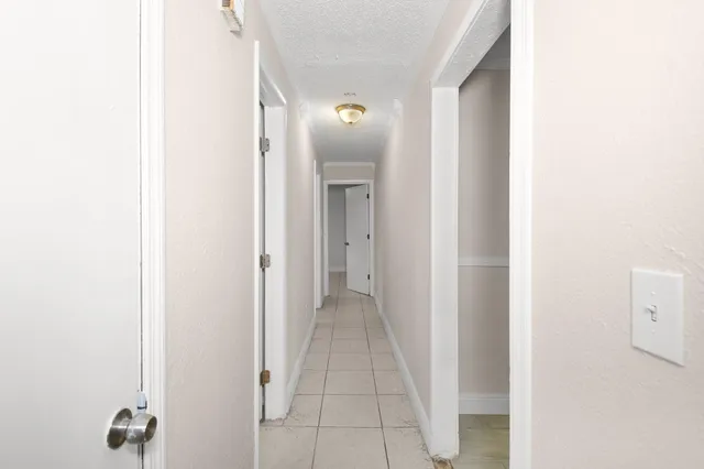 a view of a hallway with closet