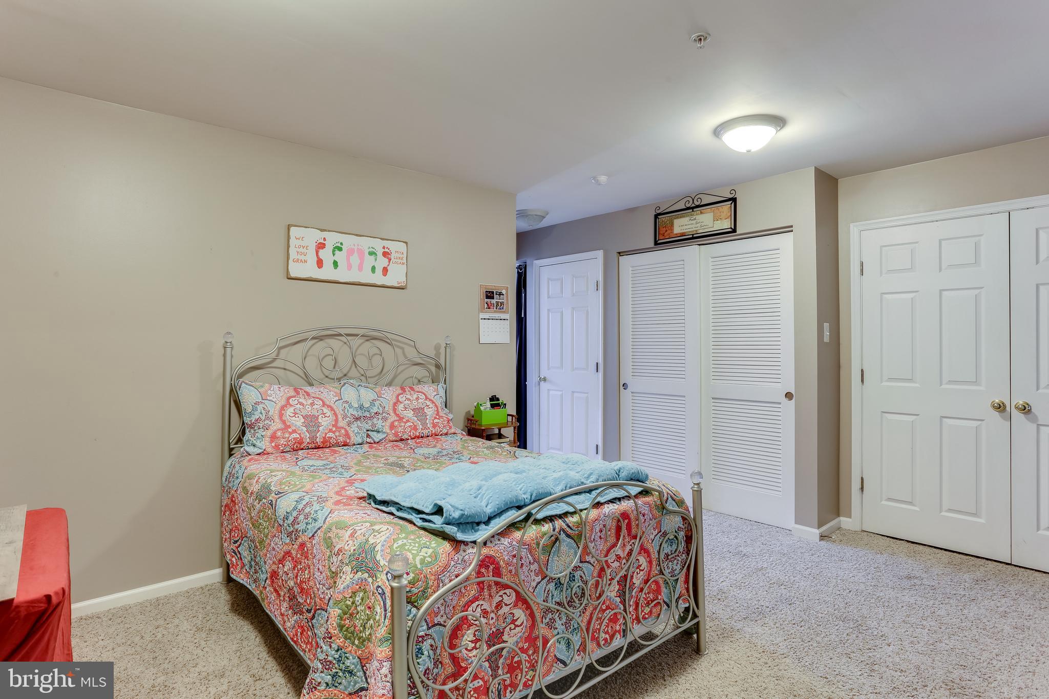 9901 Decatur Road Baltimore, MD 21220 - Photo 3 of 33 a bedroom with a bed and a painting on the wall