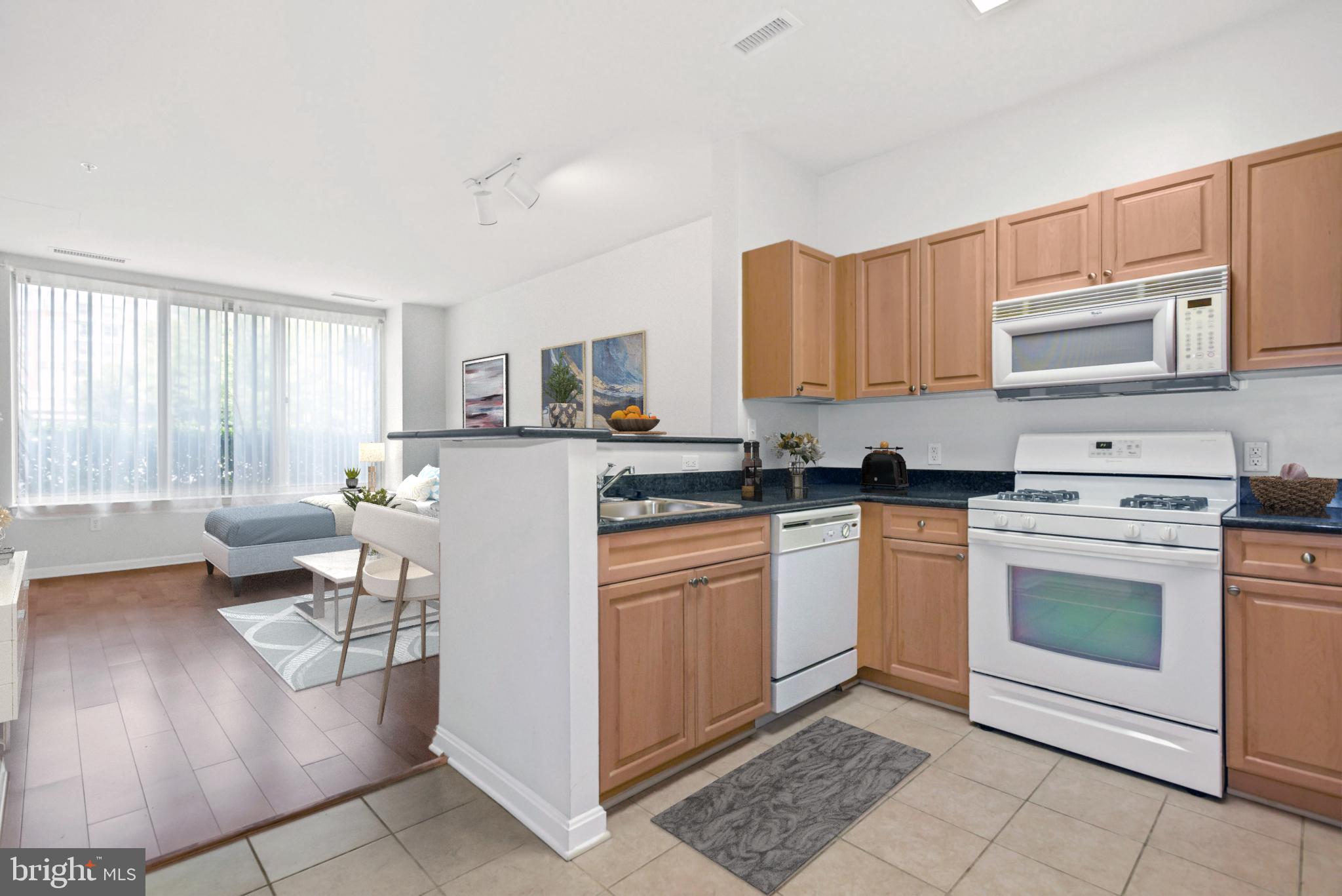 2726 Gallows Road, Unit 102 Vienna, VA 22180 - Photo 5 of 20 Galley kitchen, granite countertops