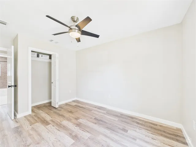 a view of a big room with wooden floor