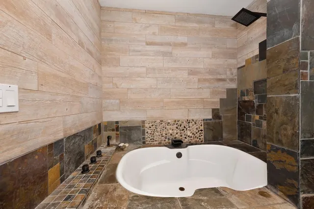 a kitchen with stainless steel appliances granite countertop sink and stove
