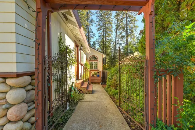 a front view of a house with a garden