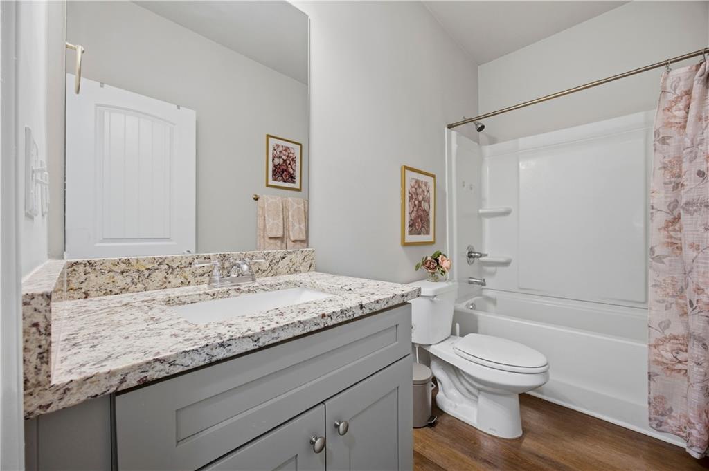70 Gold Mine Road Grantville, GA 30220 - Photo 17 of 23 a bathroom with a granite countertop sink a toilet and shower