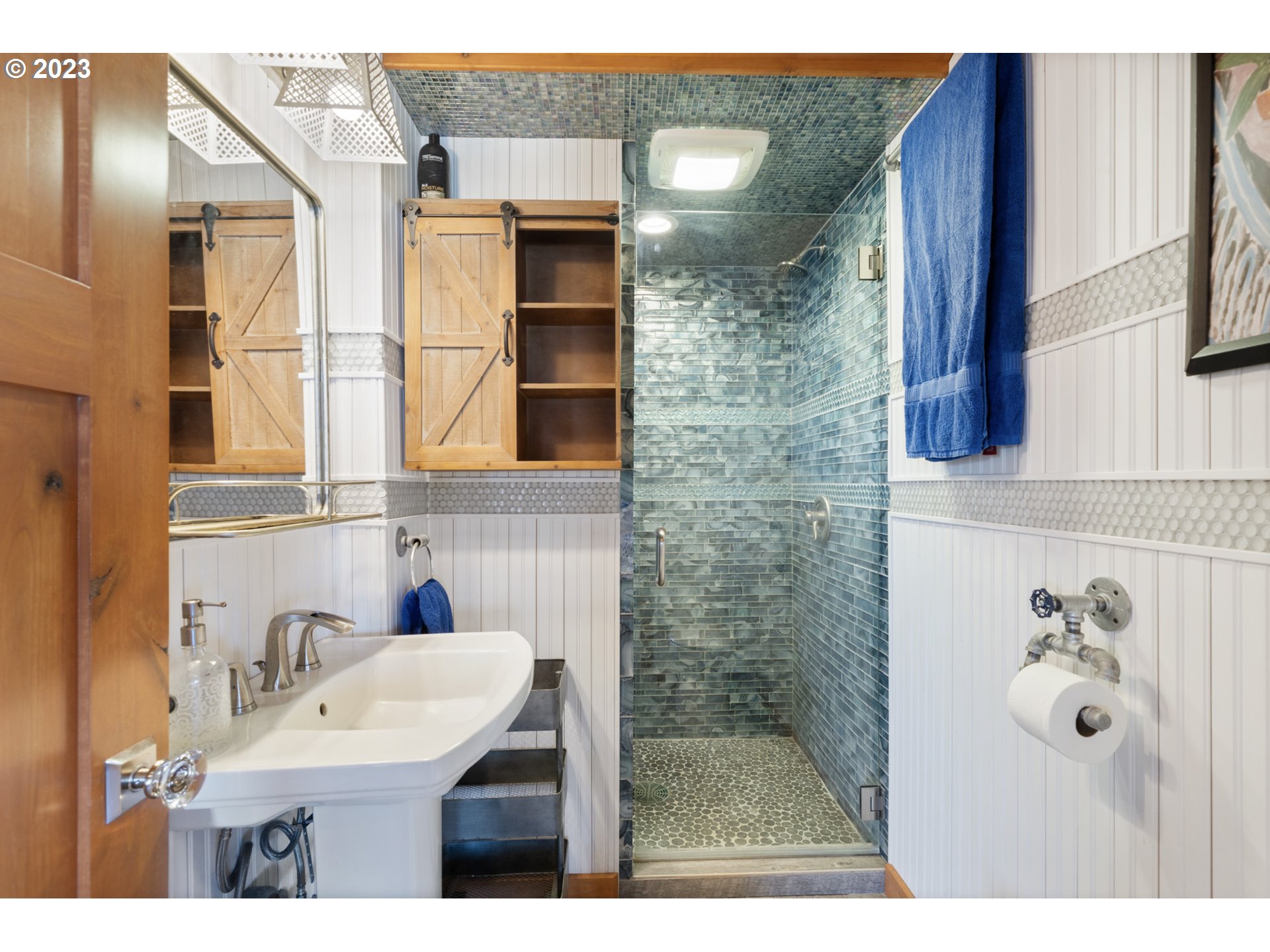 5430 2nd Street Northwest Tillamook, OR 97141 - Photo 20 of 48 a bathroom with a sink and mirror