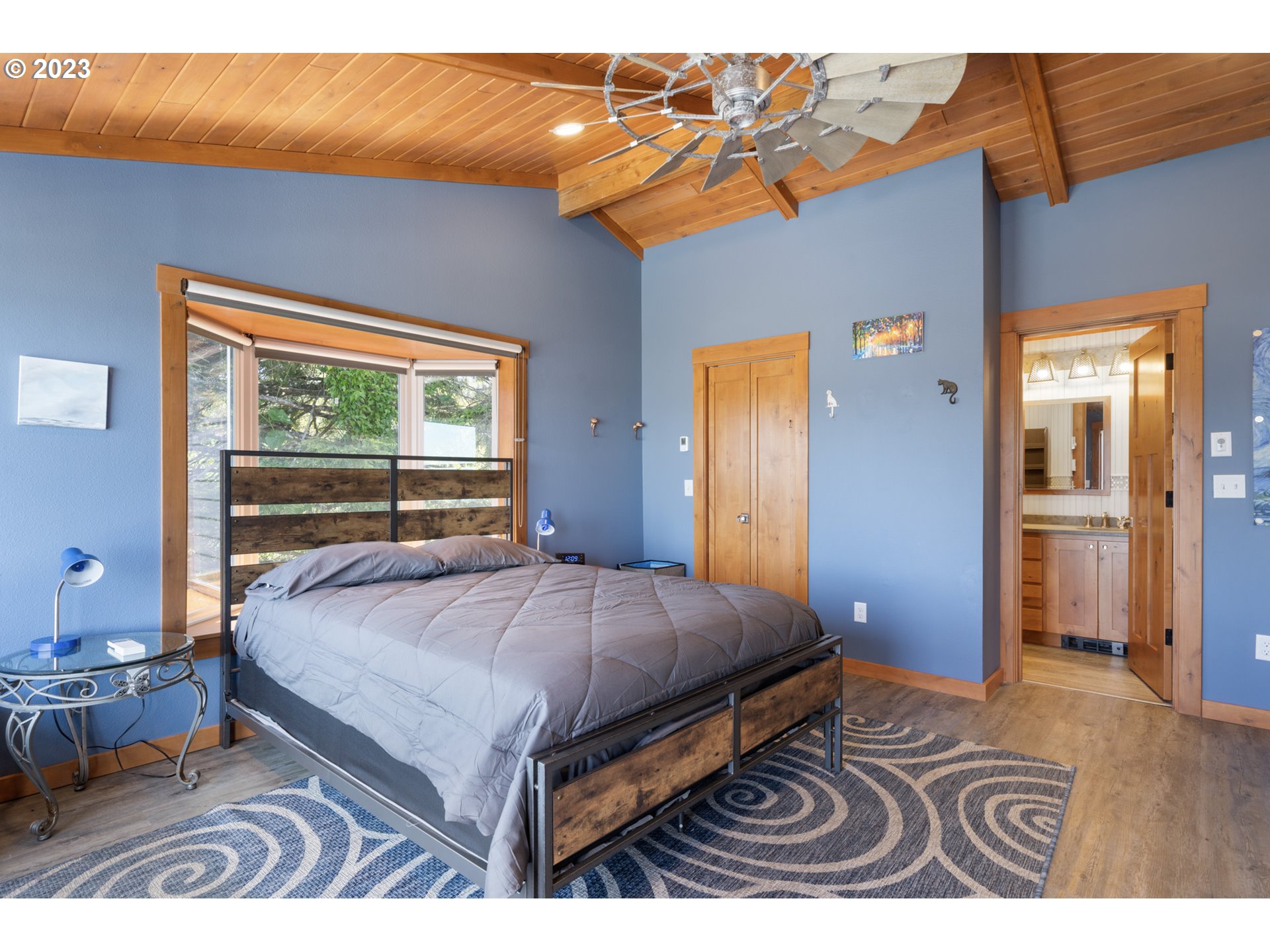 5430 2nd Street Northwest Tillamook, OR 97141 - Photo 22 of 48 a bedroom with a bed and a window