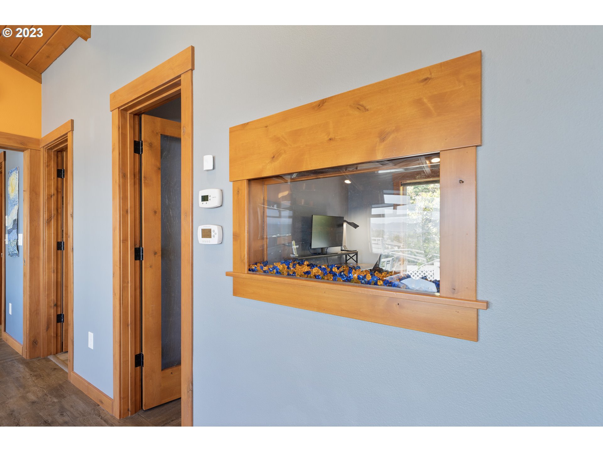 5430 2nd Street Northwest Tillamook, OR 97141 - Photo 26 of 48 a view of a room that has a large window and wooden floor