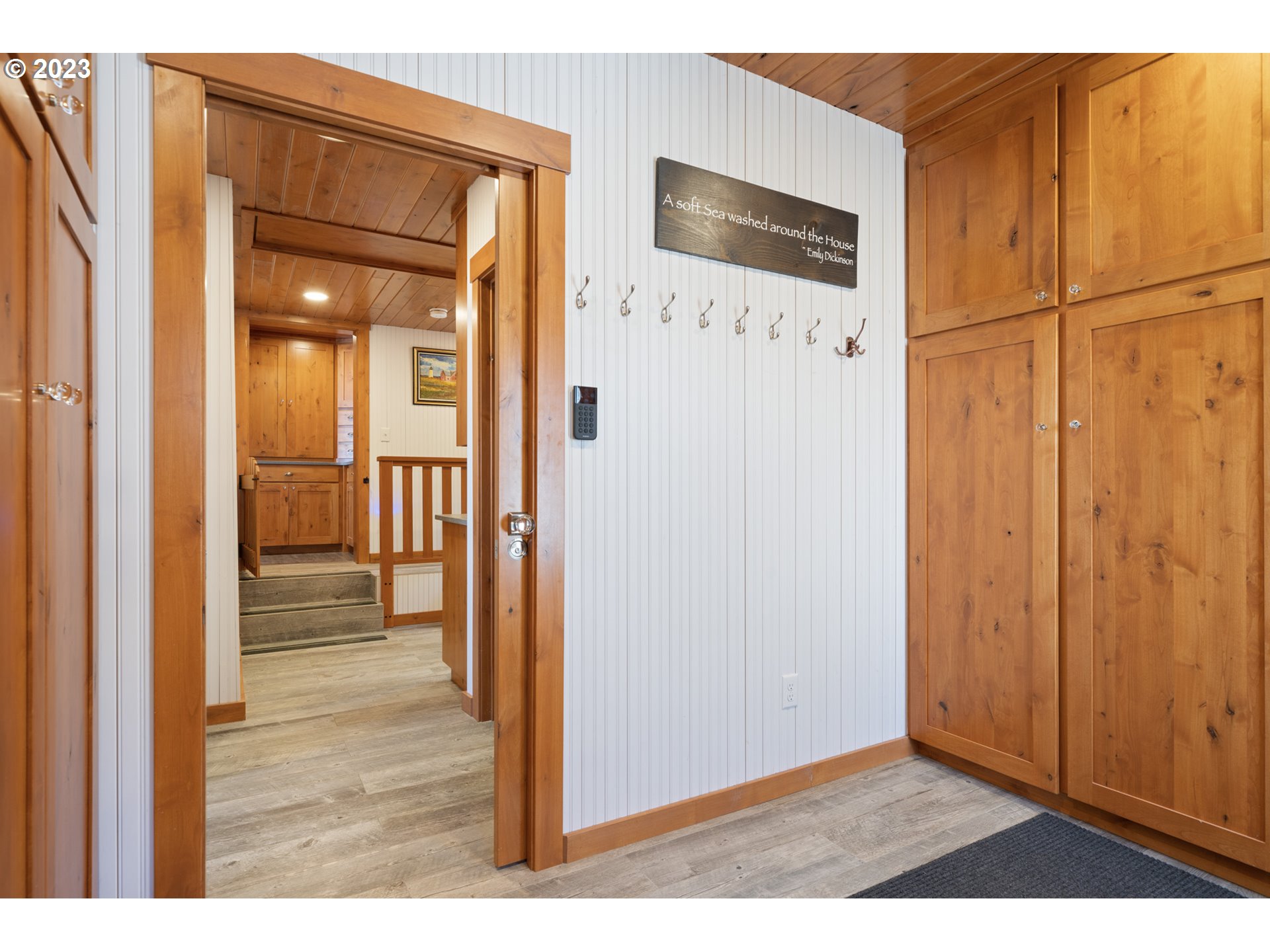 5430 2nd Street Northwest Tillamook, OR 97141 - Photo 35 of 48 a view of a hallway with wooden floor and entryway