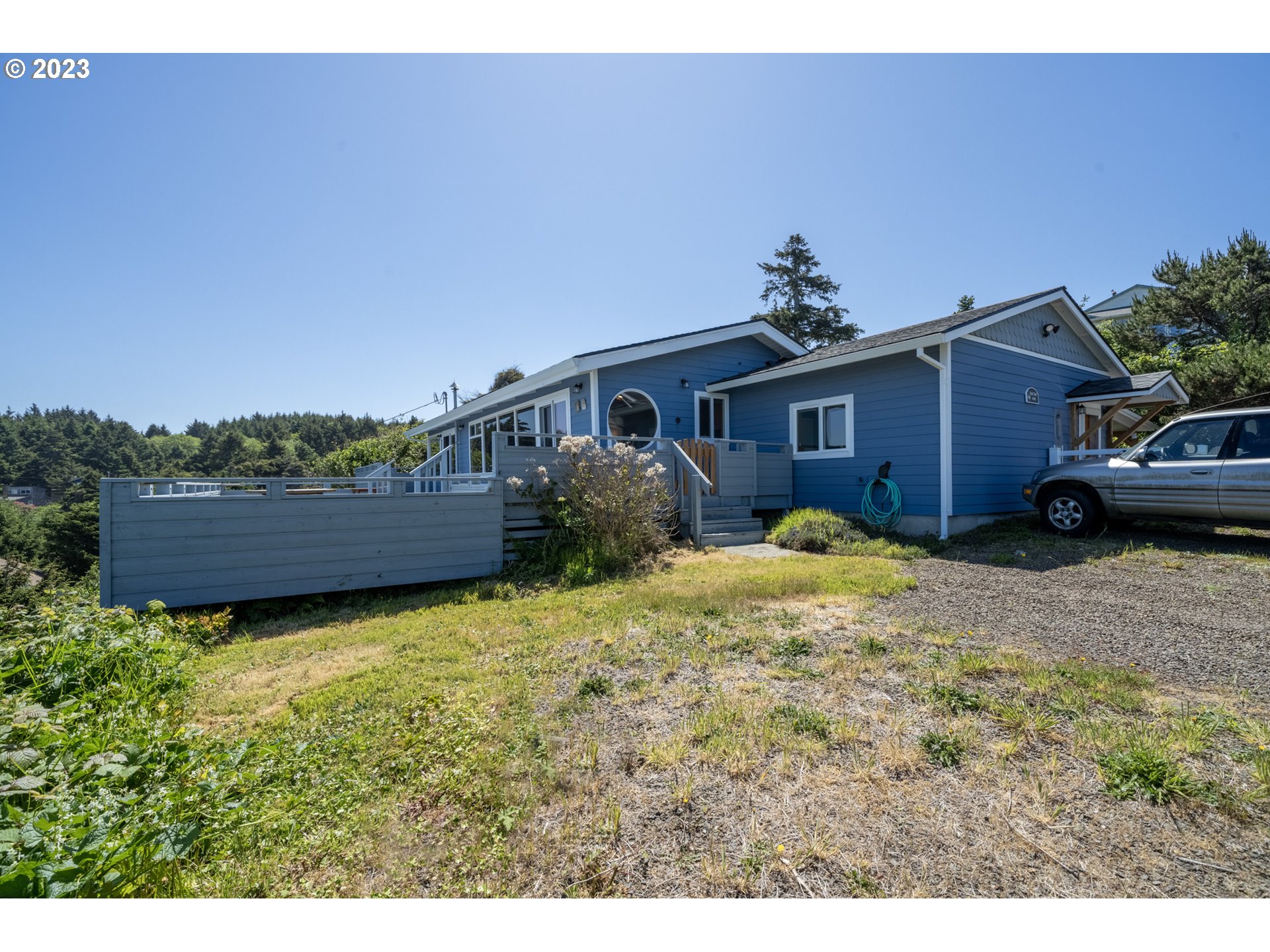 5430 2nd Street Northwest Tillamook, OR 97141 - Photo 46 of 48 a front view of a house with a yard